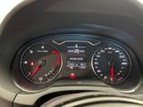 a close up of a car dashboard with a speedometer and a steering wheel