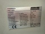 a sign on the wall stating that there is a machine