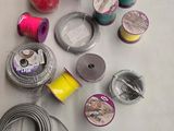 many spools of thread and spools of thread on a table