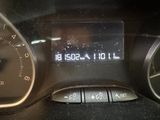 a digital clock on the dashboard of a car