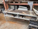 a workbench that has a lot of tools on it