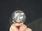 a person holding a glass of water in their hand