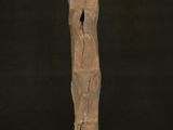 woman standing in front of a wooden cross with her arms outstretched