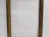 a gold picture frame with a white background