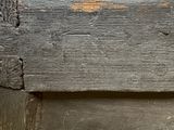 a close up of a piece of wood with peeling paint on it