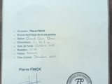 certificate of authenticity of a piece of paper on a wooden table