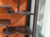 a glass display case with three shelves in it