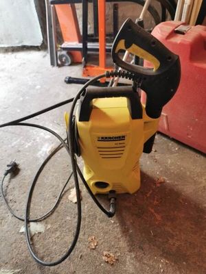 a yellow and black power washer sitting on the floor