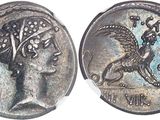 a close up of a coin with a bird on it