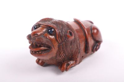 an image of a figurine of a dog on a white background