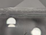 a close up of a glass of water with a small object in it