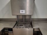 a large stainless steel oven sitting in the middle of a kitchen