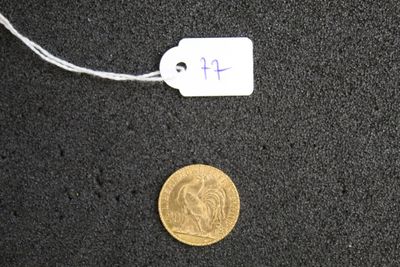 a gold coin with a price tag attached to it