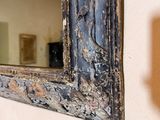 a mirror hanging on the wall in a room