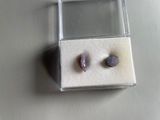 two pieces of stone in a small box on a table