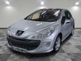 the small silver car is parked in a large room