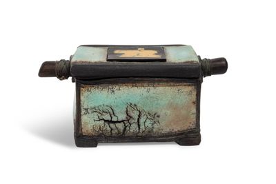a small box with a picture of a tree on it