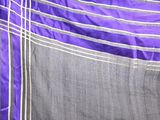 a close up of a purple and grey skirt on a mannequin