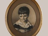 portrait of a young boy in a striped shirt in a gold frame