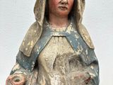 statue of a woman holding a baby in her arms