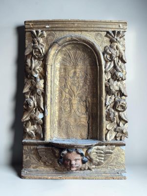 a statue of a man with a head in a niche
