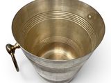 a metal bowl with a handle on a white background