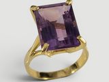 Gros plan sur une bague contenant une pierre d'améthorate