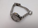an image of a wrist watch sitting on a white surface