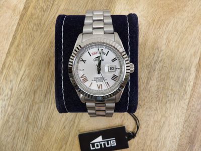 the watch is sitting on top of a blue velvet case