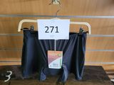 a sign on a hanger with a pair of pants on it