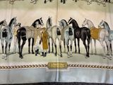 a lot of horses that are standing in a row