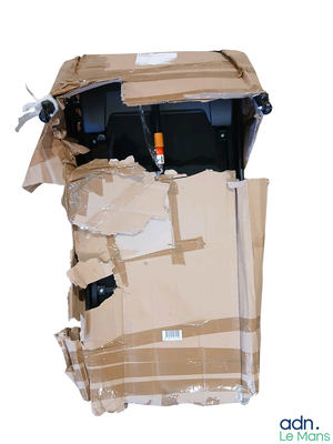 a cardboard box with a motorcycle inside of it