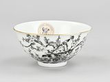 a chinese black and white bowl with gold rim