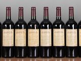 many bottles of wine lined up on a shelf
