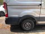 a silver van that is parked on the side of the road
