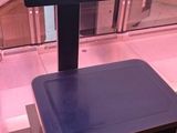 a digital scale sitting on a counter in a store