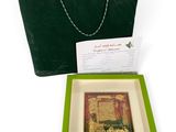 a green tote bag with a picture inside of it