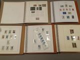 many different types of stamps on the pages of a book