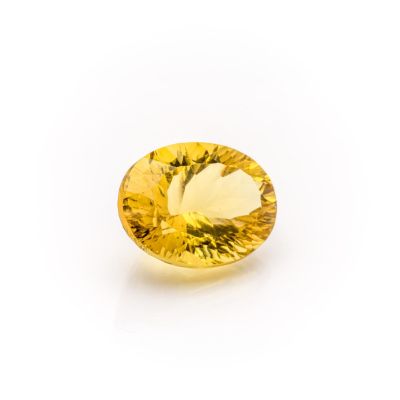 a yellow sapphire gems on a white background