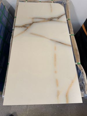 white marble slabs stacked on top of each other in a warehouse