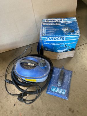 a box of emergency items on the floor next to a vacuum