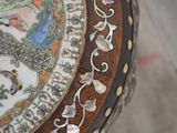 a close up of a decorative table with shells on it
