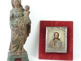 statue of jesus holding a child in his arms next to a picture of a woman