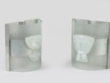 two pieces of glass with a bow on them