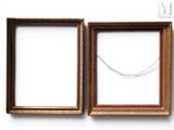 two empty picture frames with a necklace hanging from the middle