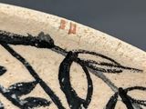 a close up of a bowl with a design on it