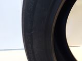 the tire of a car with a flat tire on a white surface