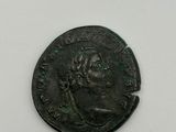 a coin with a man ' s face on it