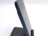 a cell phone that is sitting on top of a stand