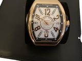 a watch that is sitting on top of a black case
